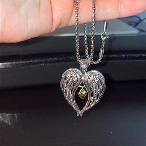 Angel wing necklace with gold heart center